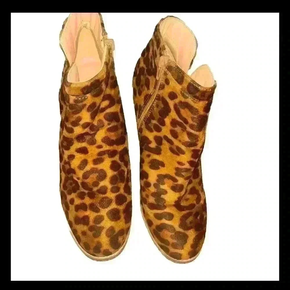 Leopard print wedge boots in the size 8.